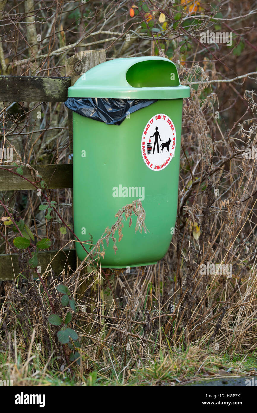 dog poop bin on fence Stock Photo Alamy