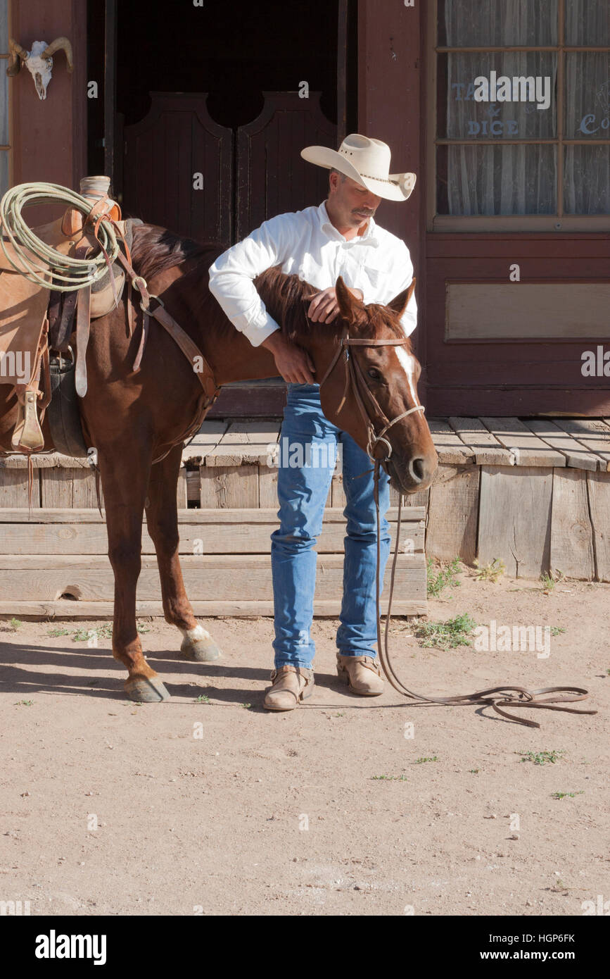 cowboy with his horse on western movie set HGP6FK