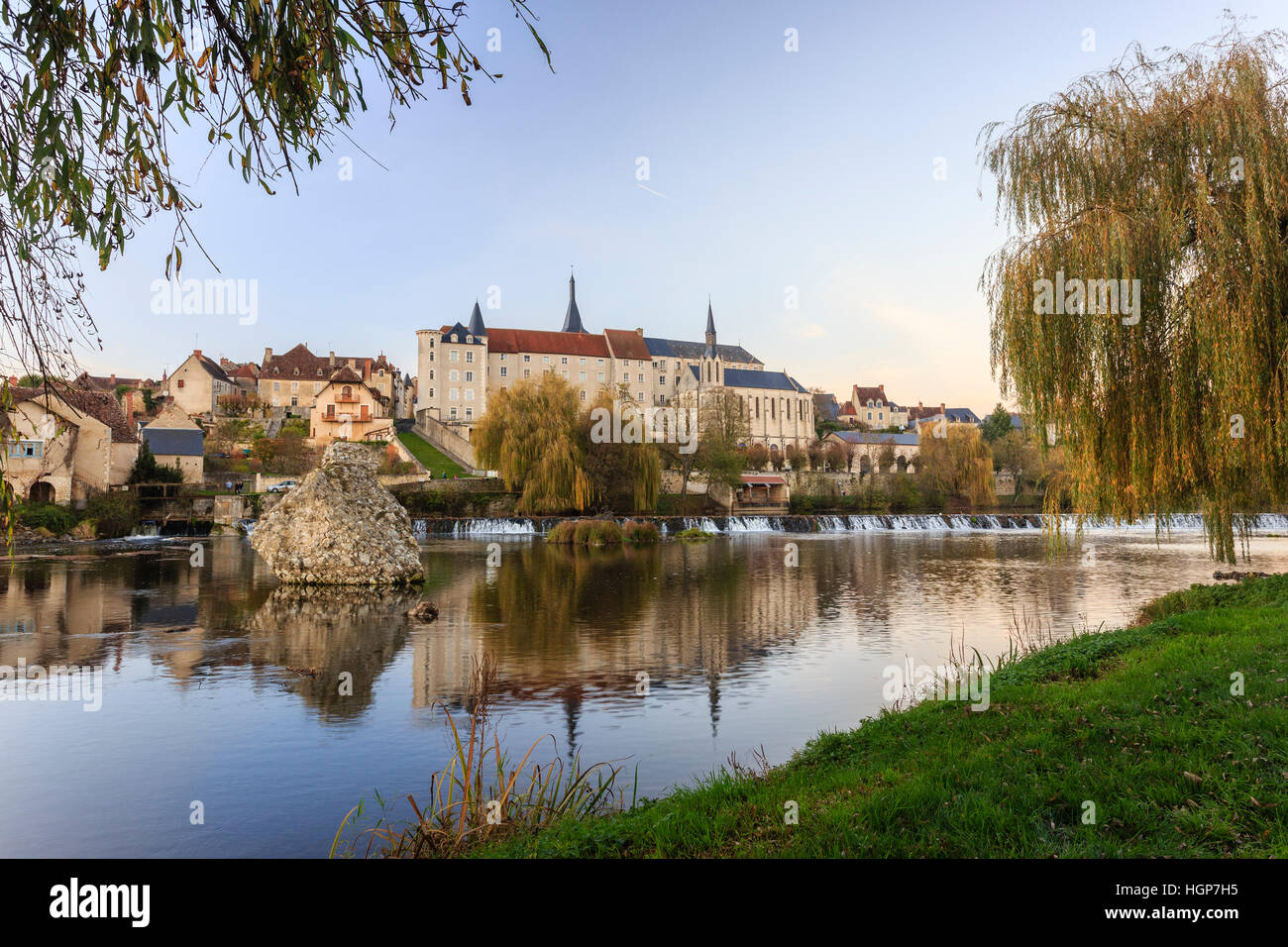 France, Indre, Saint Gaultier, river the Creuse and former priory in the evening Stock Photo