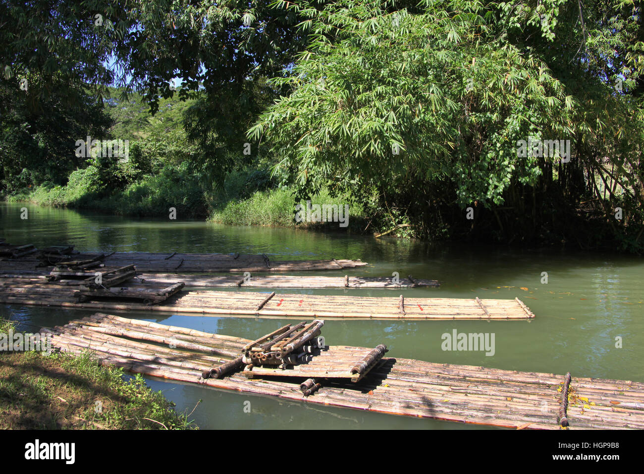 Bamboo rafts on the Martha Brae river, popular tourist day trip, Falmouth, Jamaica. Close to Montego Bay & Ocho Rios. Stock Photo