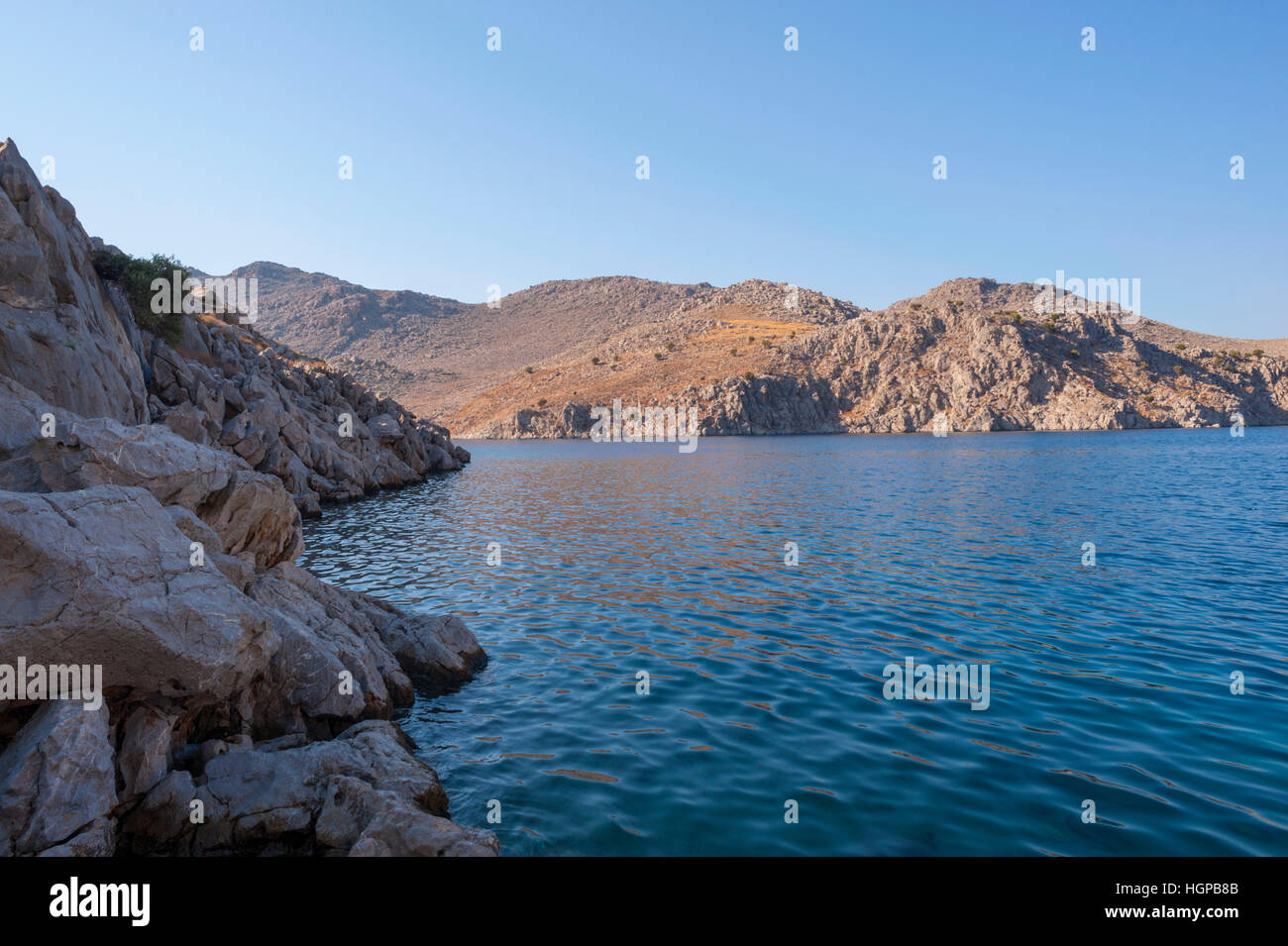 Looking out from Saint Nicholas bay on the Greek island of Symi. Stock Photo