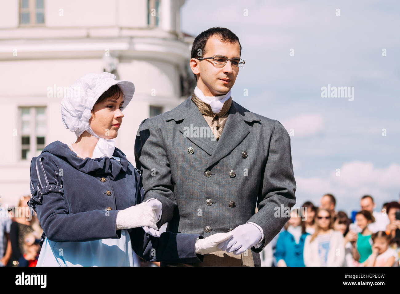 Minsk, Belarus - September 3, 2016: Couple of young people dressed in clothes of the 19th century dancing Polonaise at the celebration of the Day of M Stock Photo