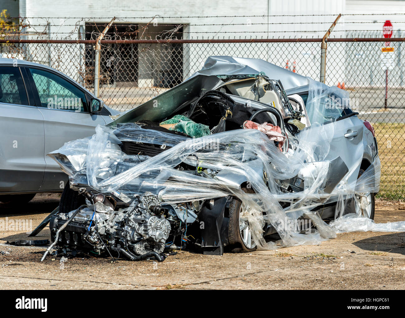 The wreckage of a completely totalled automobile.  This fatal accident was so severe that the car is beyond recognition. Stock Photo