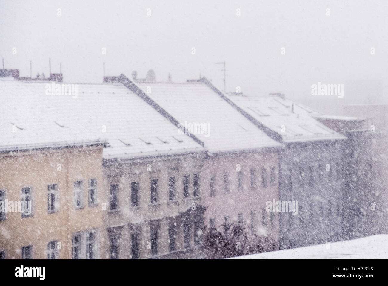 snow cityscape / rooftops during winter snowing Stock Photo