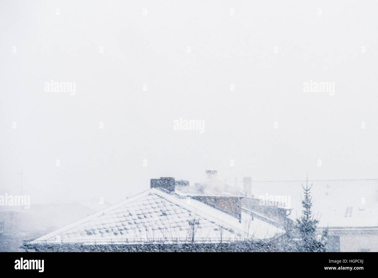 snow cityscape / rooftops during winter snowing Stock Photo