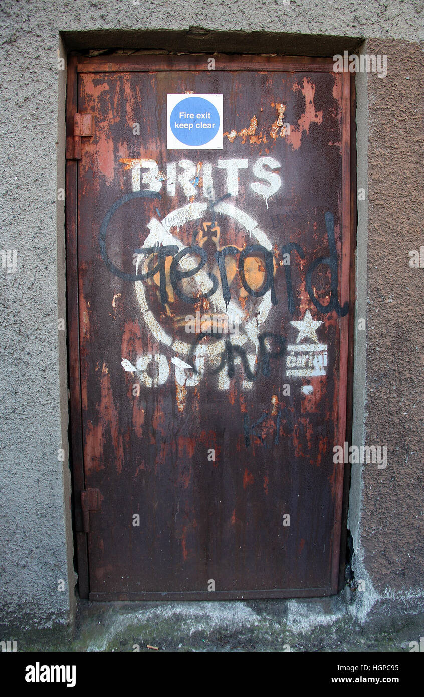 Brits Out painted on a Falls Road door in Belfast Stock Photo