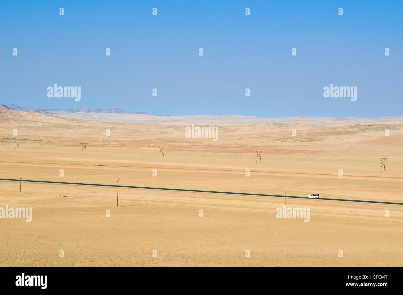 Electric lines along the road between Aus and Luderiz, Namibia Stock Photo