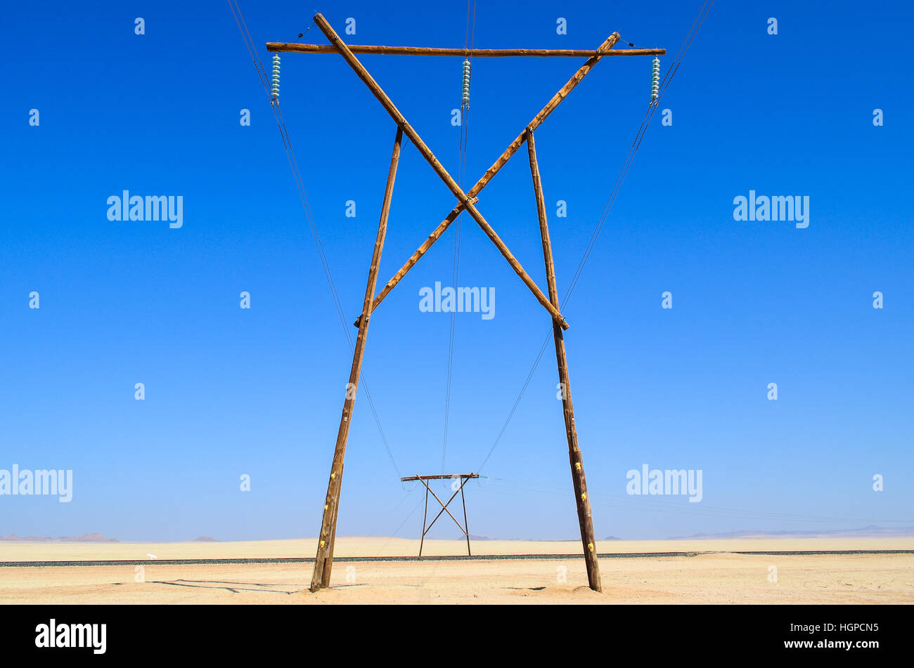 Electric lines along the road between Aus and Luderiz, Namibia Stock Photo