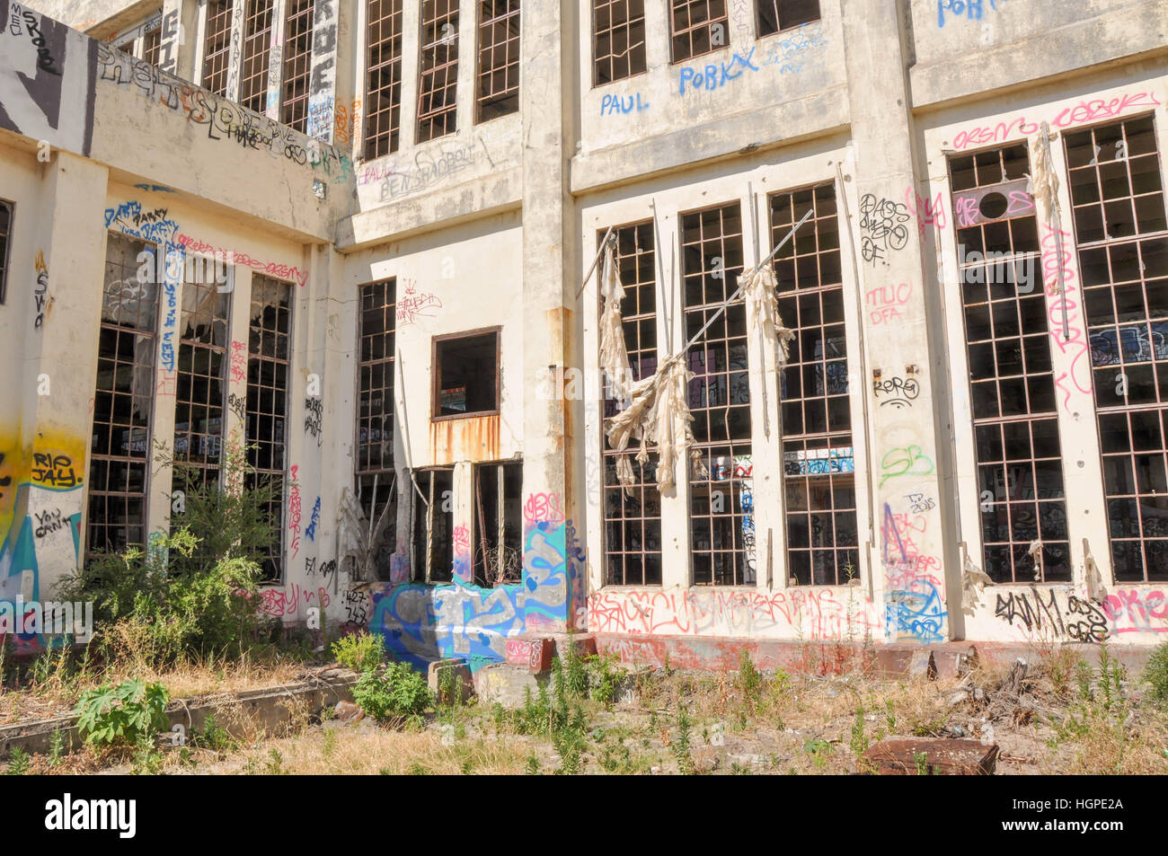 Old abandoned South Fremantle Power Station with youth tagging, broken windows and remnants in
