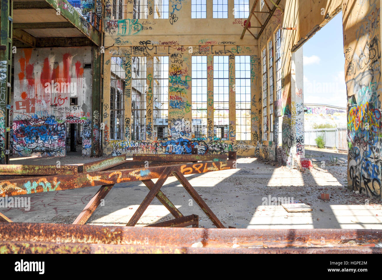 Old abandoned South Fremantle Power Station with youth tagging, broken windows and empty shell