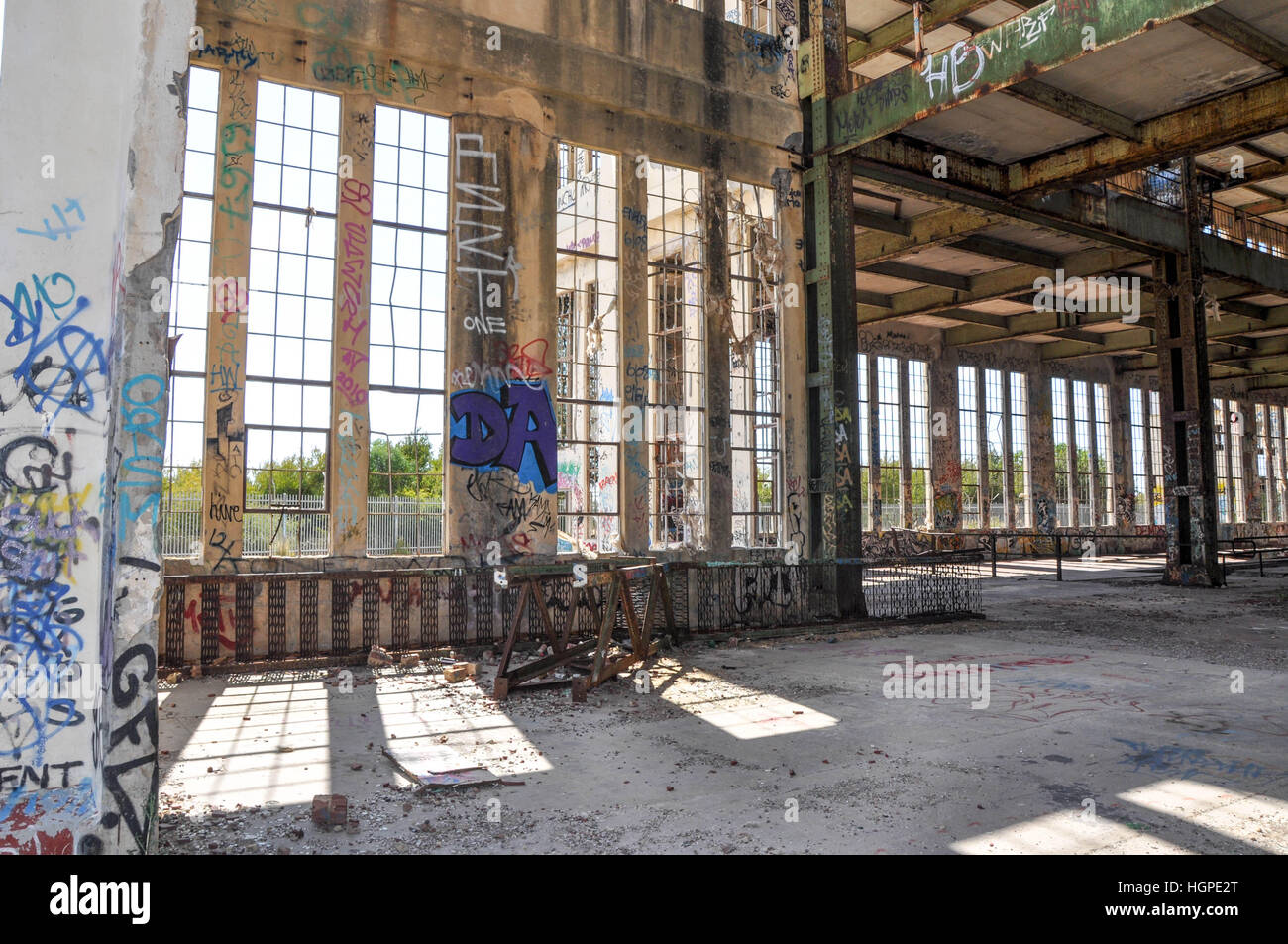 Old abandoned South Fremantle Power Station with youth tagging, broken windows and empty shell