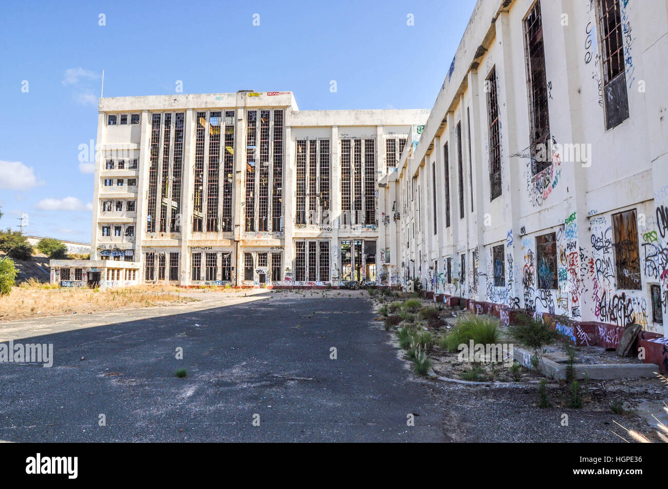 Old abandoned South Fremantle Power Station with youth tagging, broken windows and empty shell