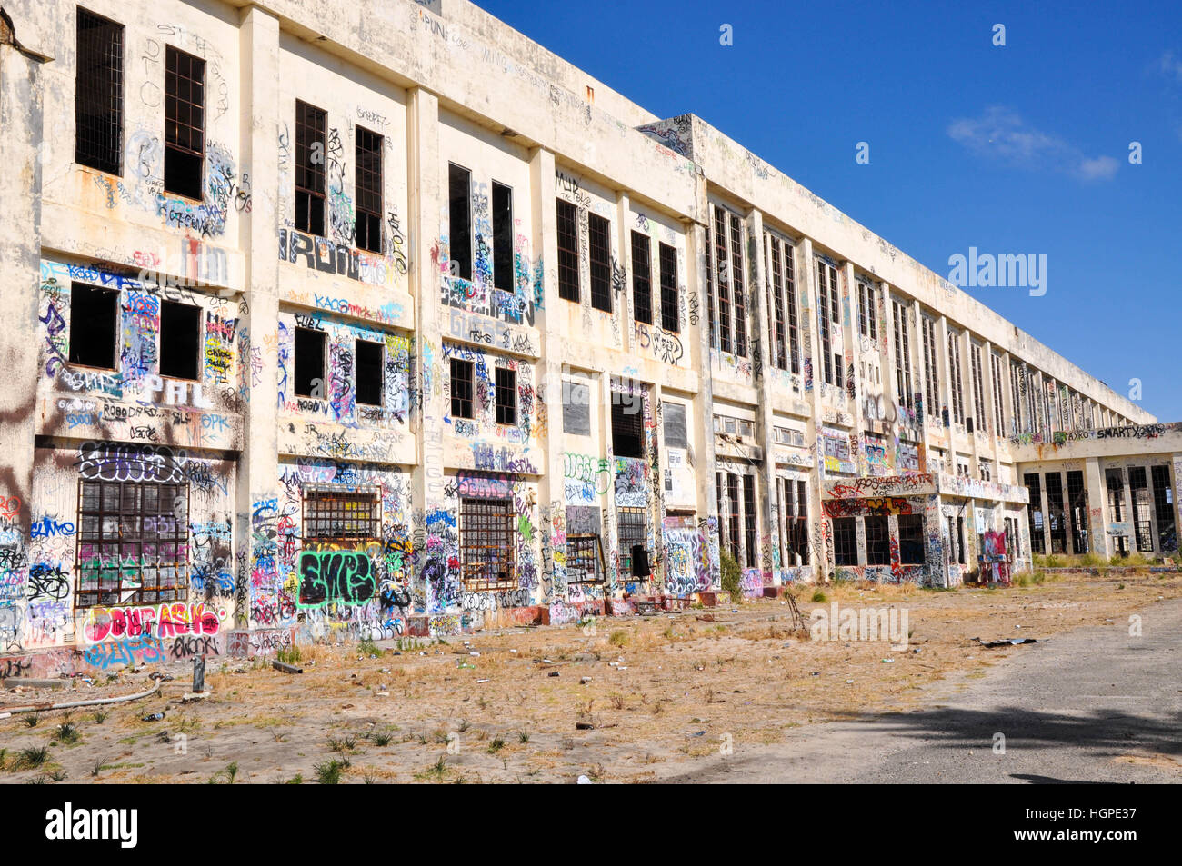 Old abandoned South Fremantle Power Station with youth tagging, broken windows and empty shell