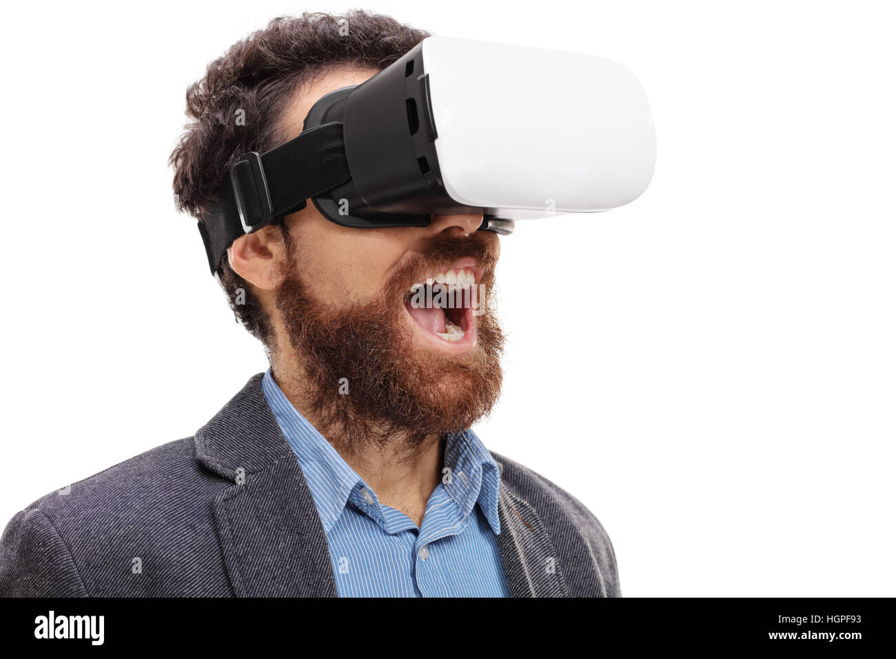 Amazed bearded man wearing virtual reality goggles isolated on white background Stock Photo