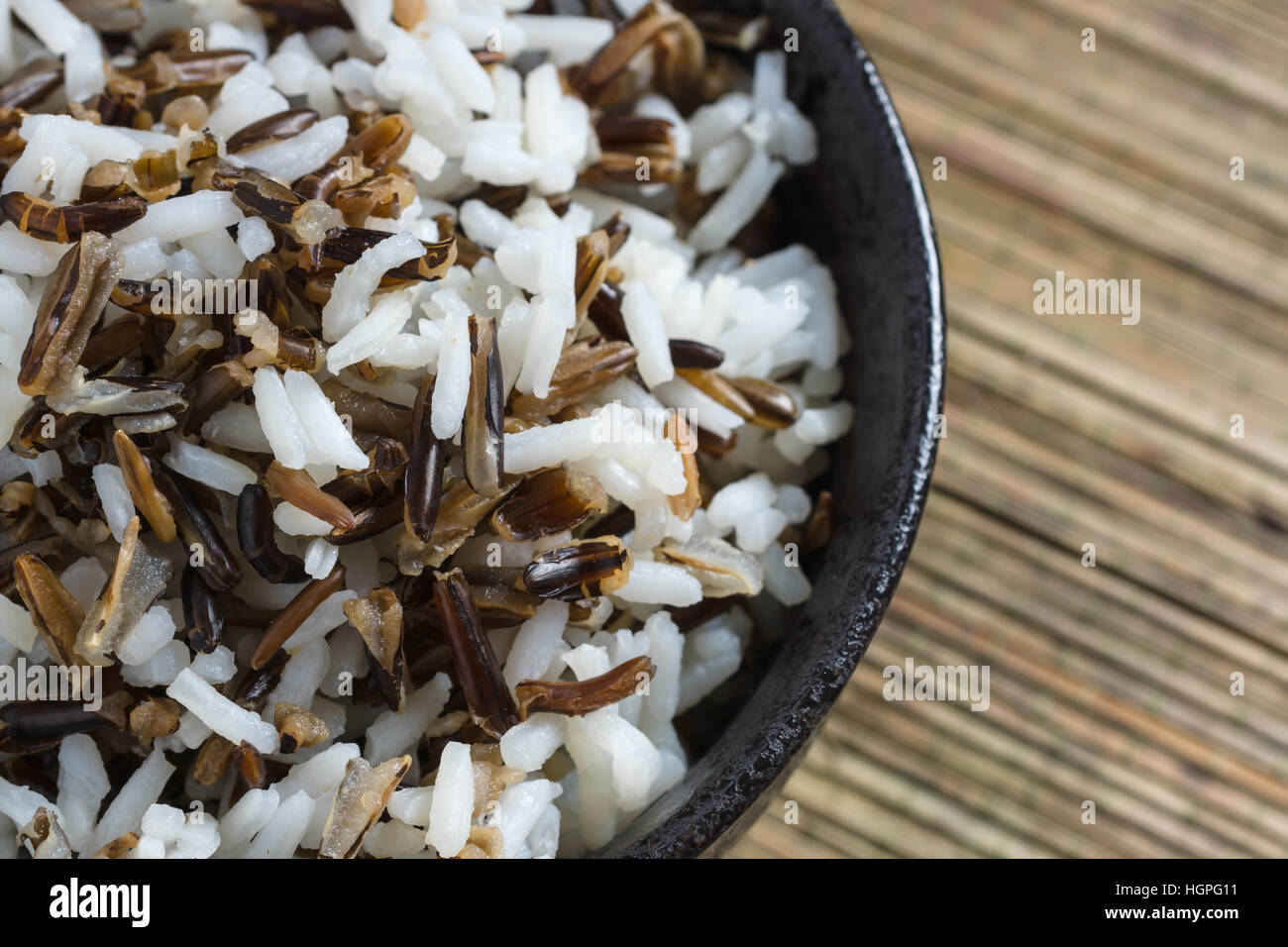 Mix of cooked native North American wild rice and boiled long grain rice Stock Photo