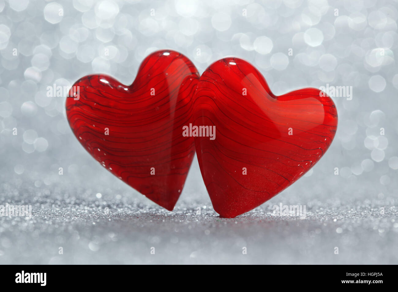 Shiny red hearts background Stock Photo - Alamy