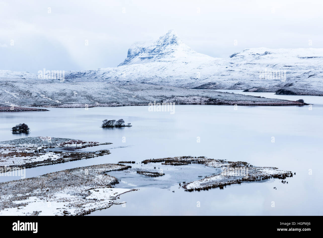 Suilven reflected in the waters of cam loch with thundersnow on the route of the north coast 500, Assynt, Elphin, scotland, UK Stock Photo