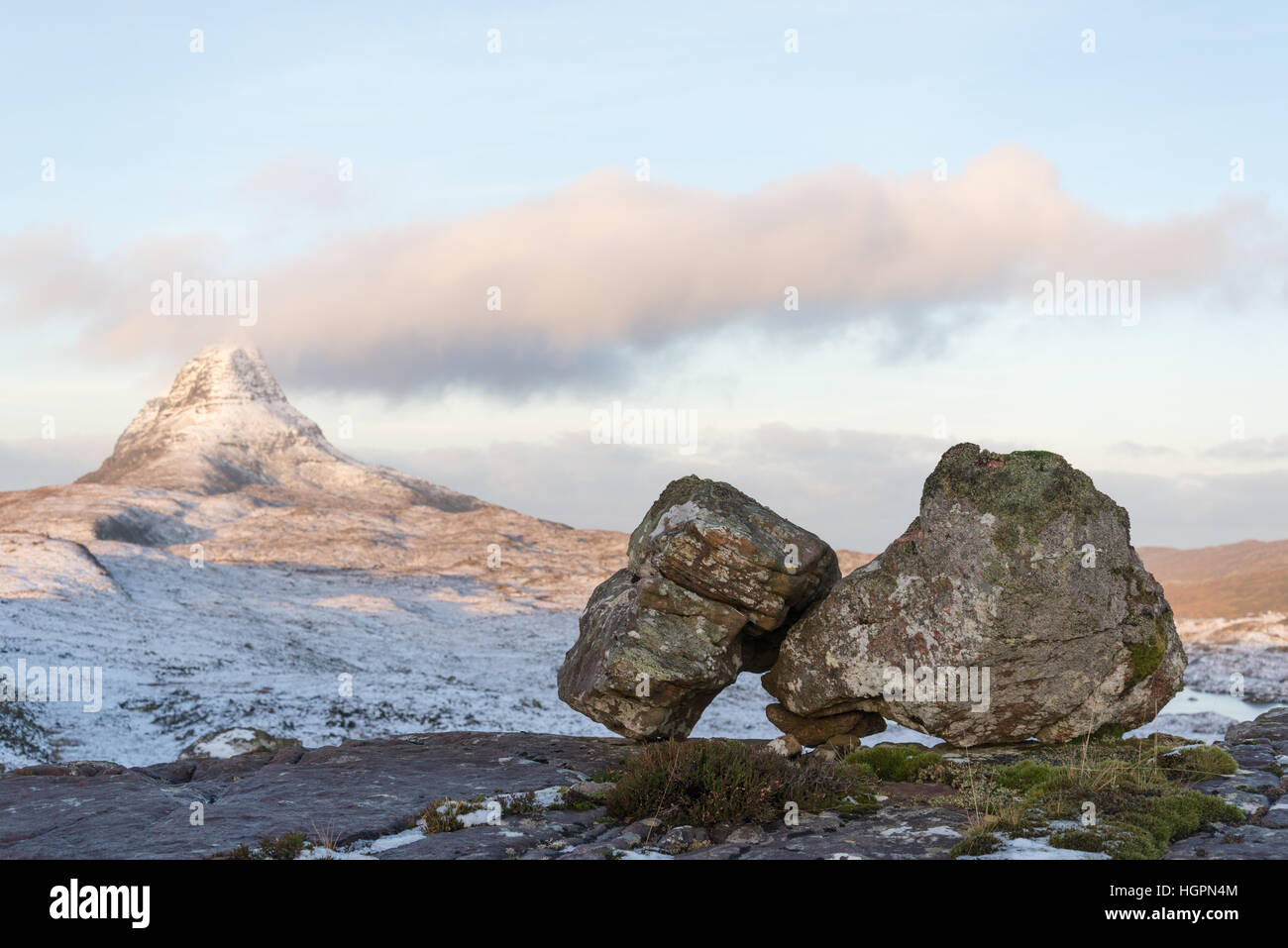 glacial erratic boulders of lewisian gneissl eft after retreating iceage, with suilven mountain behind, assynt, scotland, UK Stock Photo
