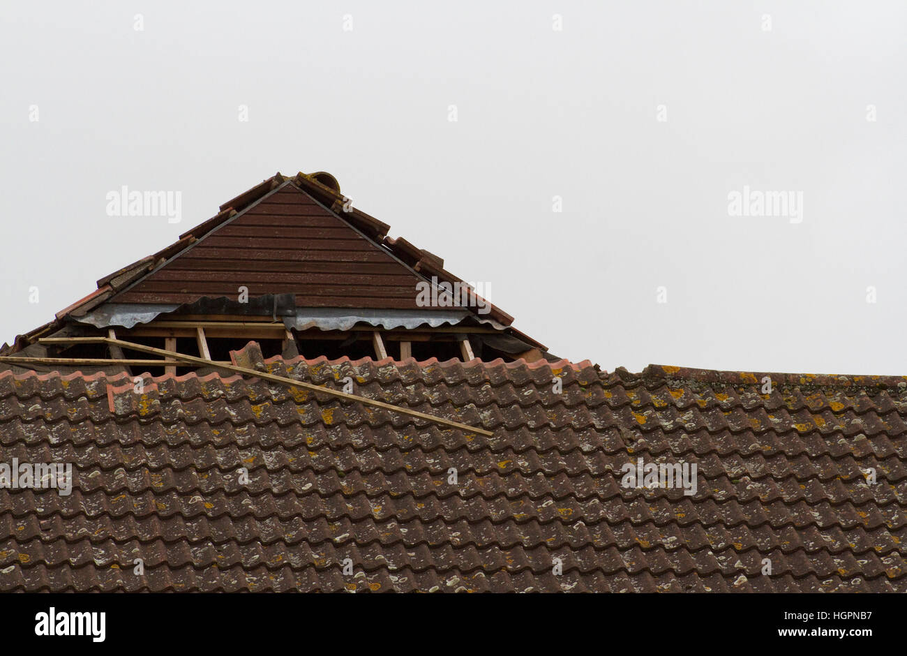 Partly demolished roof pitch of fairly modern building Stock Photo