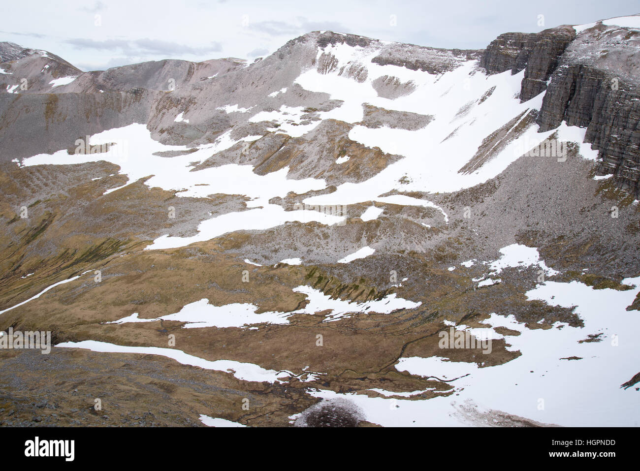 The grey corries covered in snow and ice in early summer from beinn na soccaich near fort william and ben nevis, scotland, uk Stock Photo