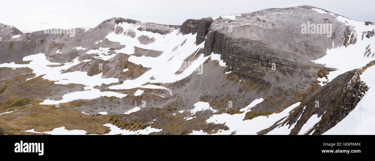 The grey corries covered in snow and ice in early summer from beinn na soccaich near fort william and ben nevis, scotland, uk Stock Photo