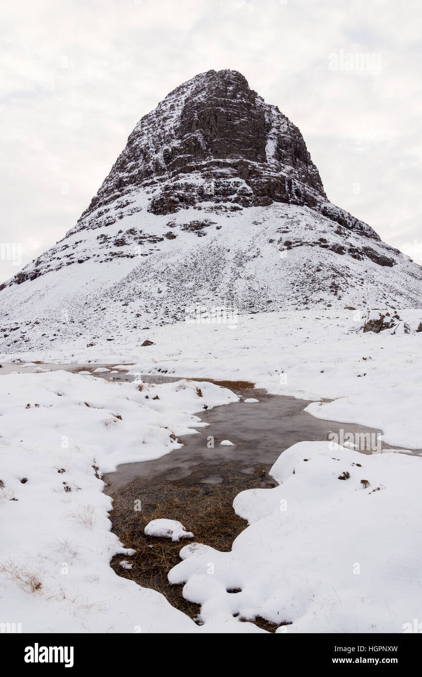 Looking up to the north-west buttress of caisteal liath on Suilven, in winter Assynt, Scotland, UK Stock Photo