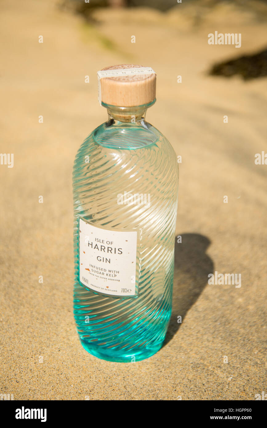 Bottle of Isle of Harris gin on hebridean beach of Traigh Iar, Isle of