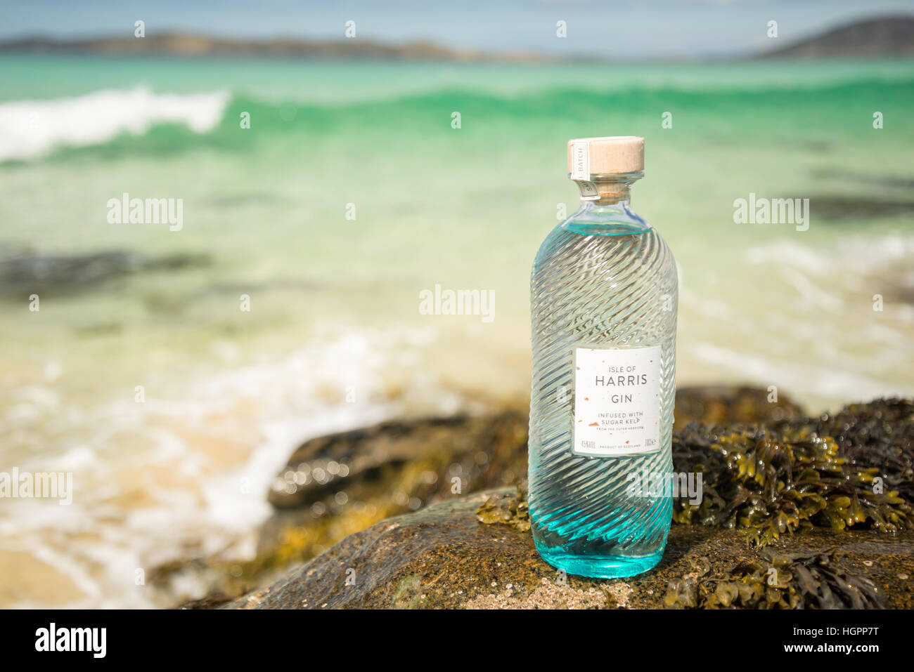 Bottle of Isle of Harris gin on hebridean beach of Traigh Iar, Isle of Harris, Outer Hebrides, scotland. Stock Photo