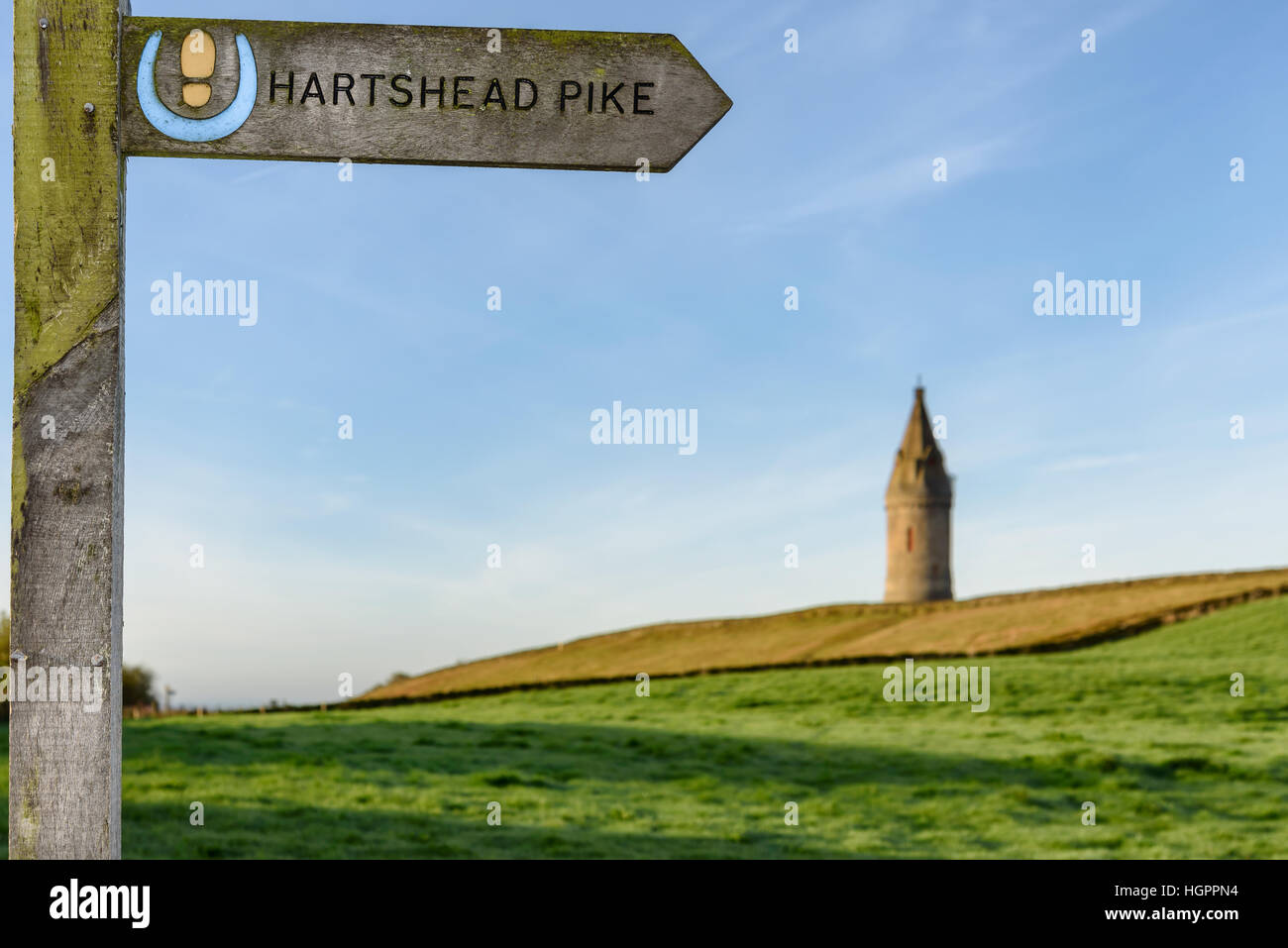 Arrow showing the direction of Hartshead Pike which is a hill in Tameside in Greater Manchester, England. Stock Photo