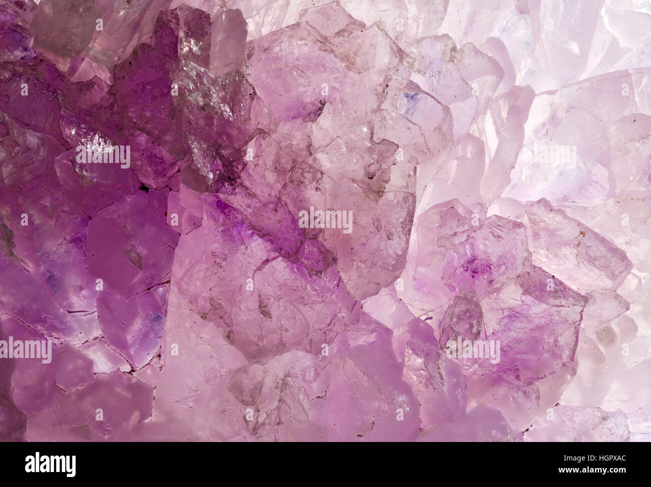 Raw, uncut rose quartz crystal close up macro Stock Photo
