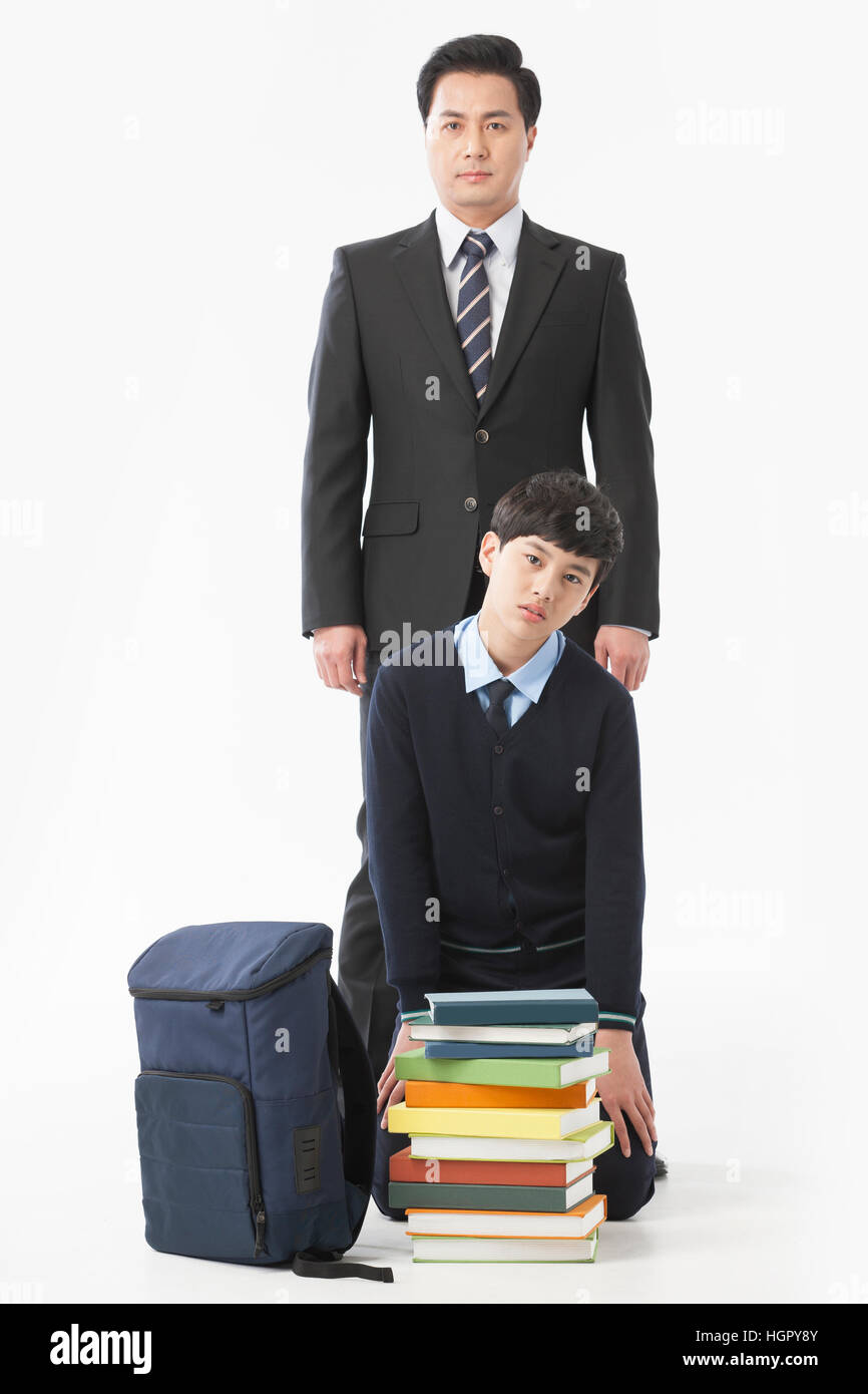 Teacher and school boy stressful with stacked books Stock Photo