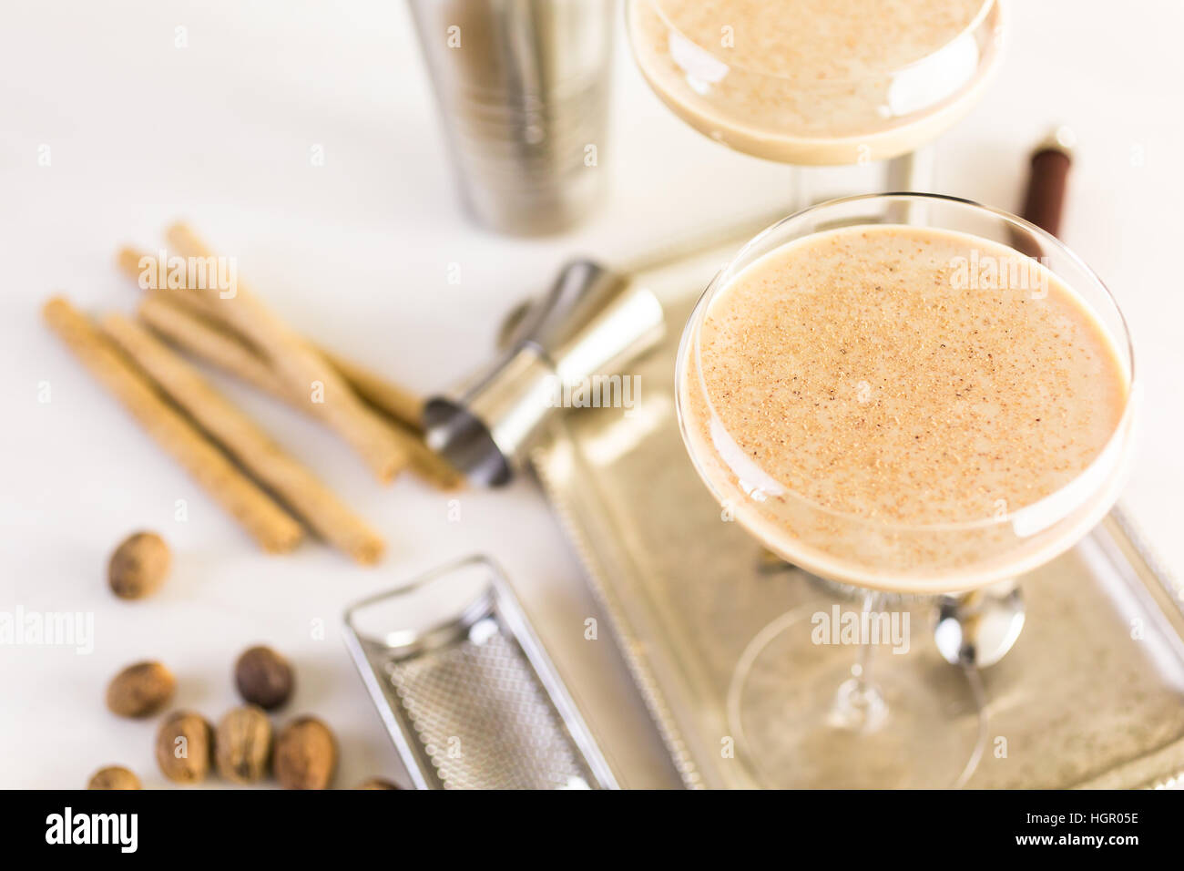 Holiday eggnog cocktail with dark rum and milk garnished with nutmeg