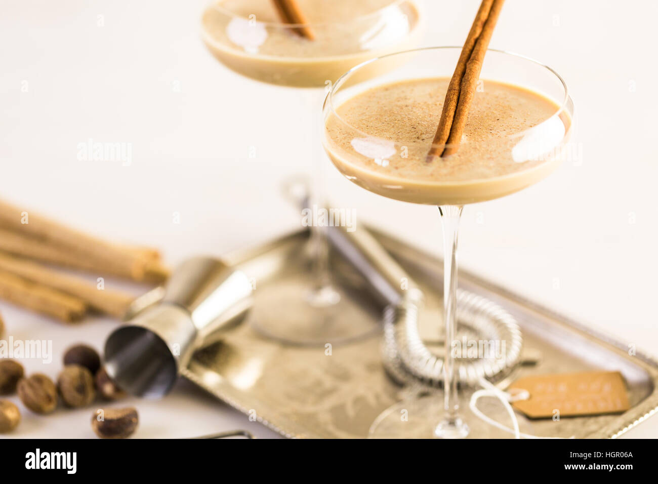 Holiday eggnog cocktail with dark rum and milk garnished with nutmeg