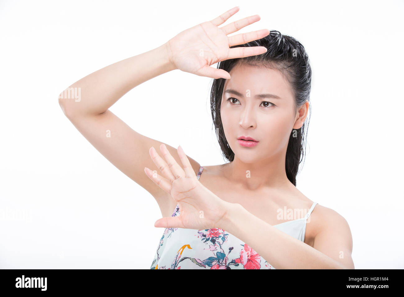 Portrait of young woman with wet hair frowing her face Stock Photo