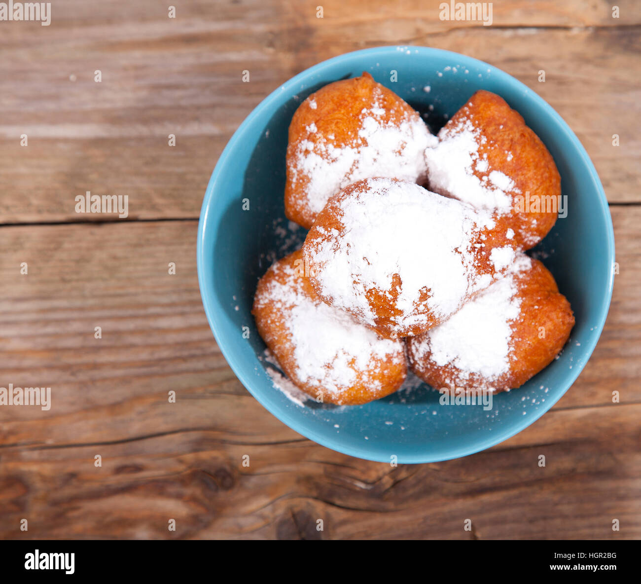 Traditional Dutch oliebollen on wooden background Stock Photo