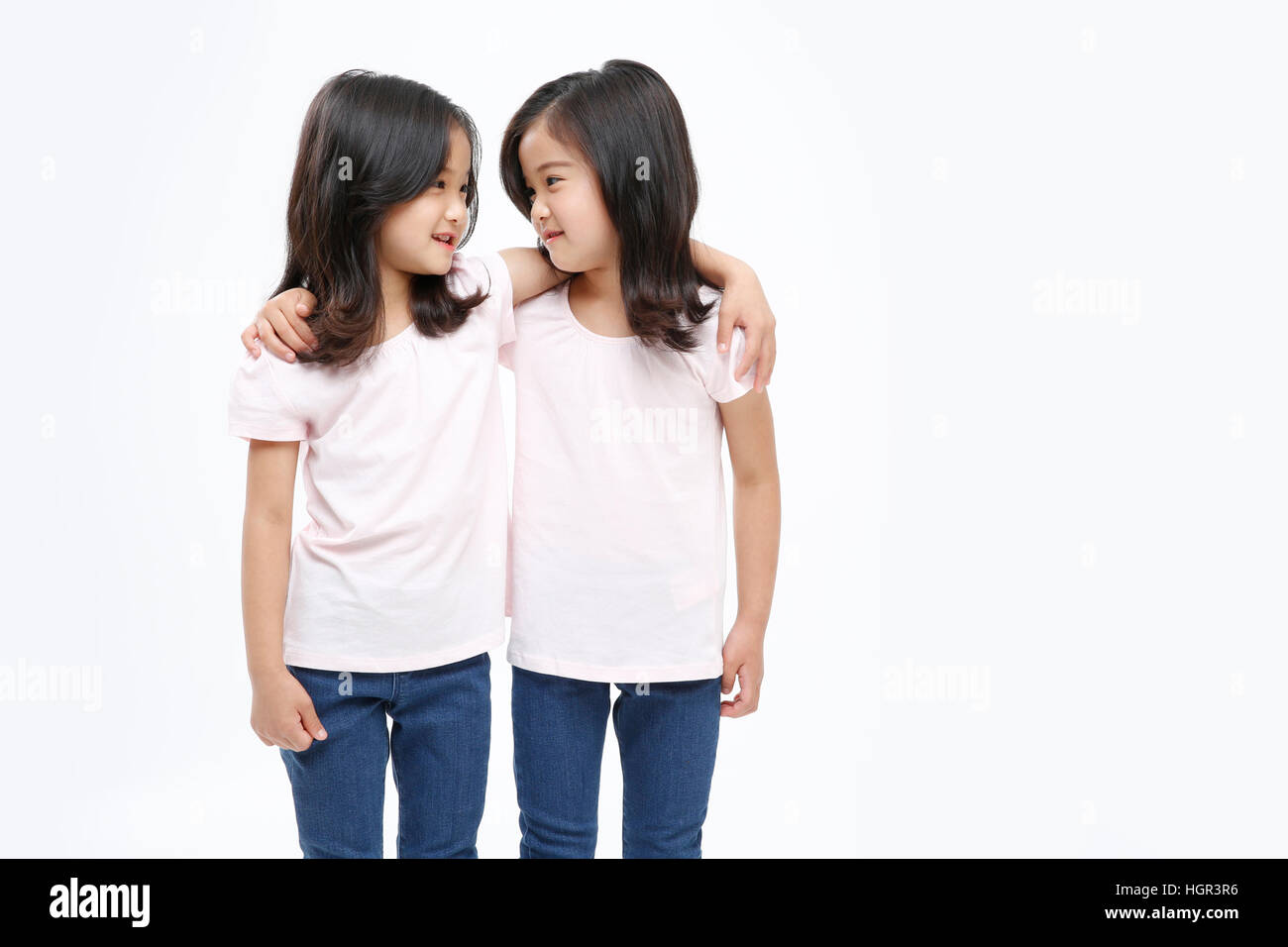 Two girls looking other smiling hi-res stock photography and images - Alamy