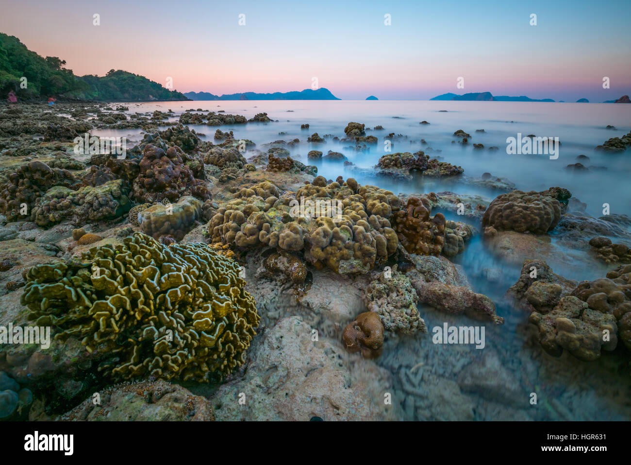 coral rock around beach during ebb tide and sunset time wide shot backgroundat  Nyaung Oo Phee, Myanmar Stock Photo