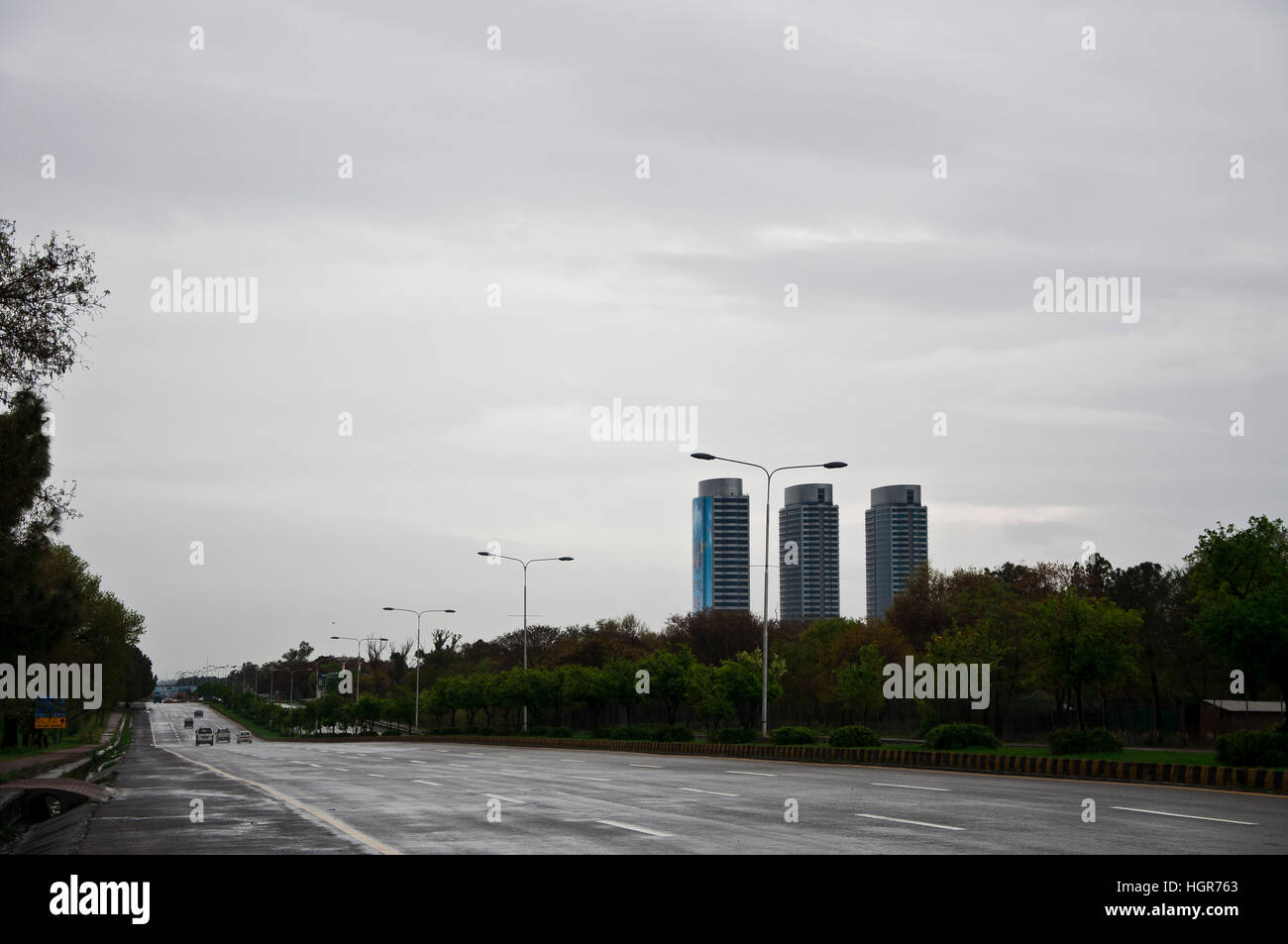 Jinnah Ave. in the capital city with Centaurus mall in the background on a cloudy day. Stock Photo