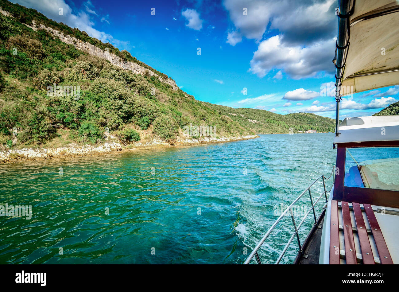 Traveling with a boat on the sea. Beautiful Sunny day with Clouds. Stock Photo