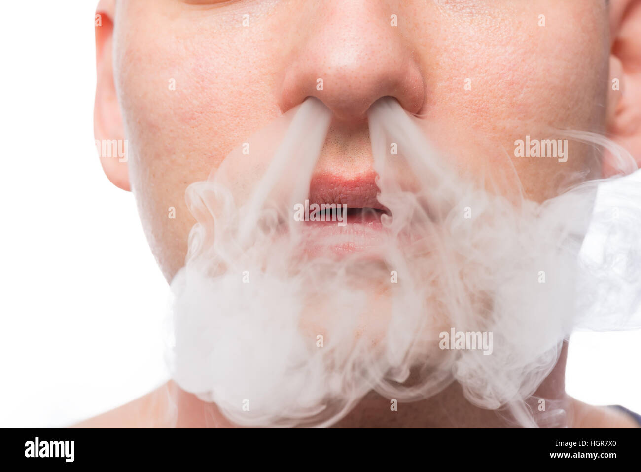 cigarette smell stuck in nose for days man a smoker cigarette smoke produces from the nose Stock Photo