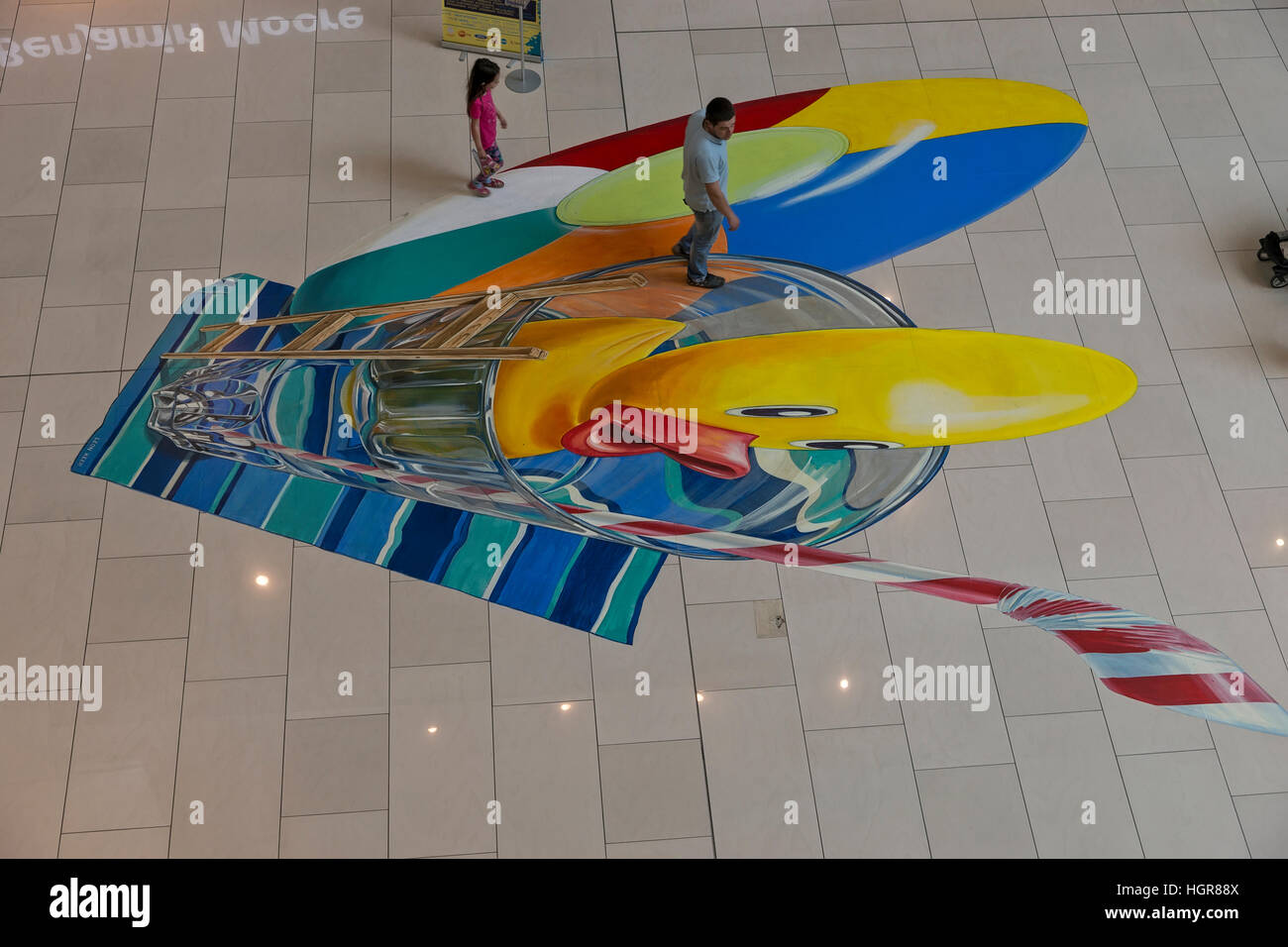 Sofia, Bulgaria - May 24, 2016: Two girls play on painted the floor in the shopping mall Sofia Ring Stock Photo