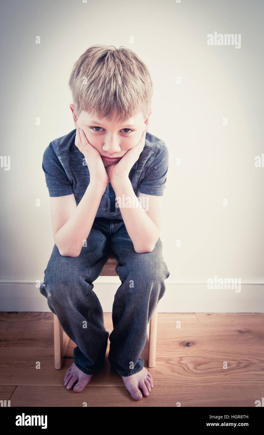 Concept of a lonely child suffering from a family in poverty Stock Photo