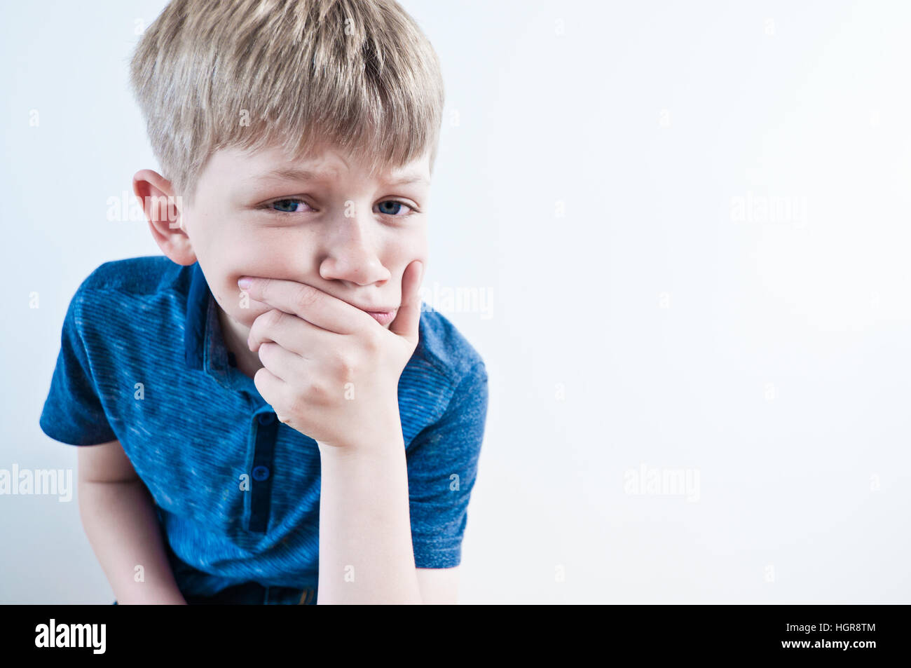 A worried boy thinking deeply Stock Photo