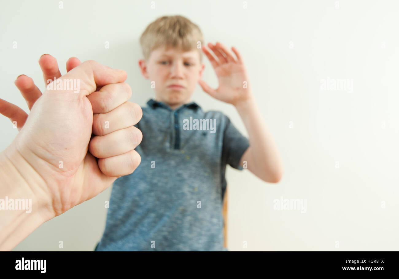 Point of view image of a young boy being threatened by an abusive parent Stock Photo
