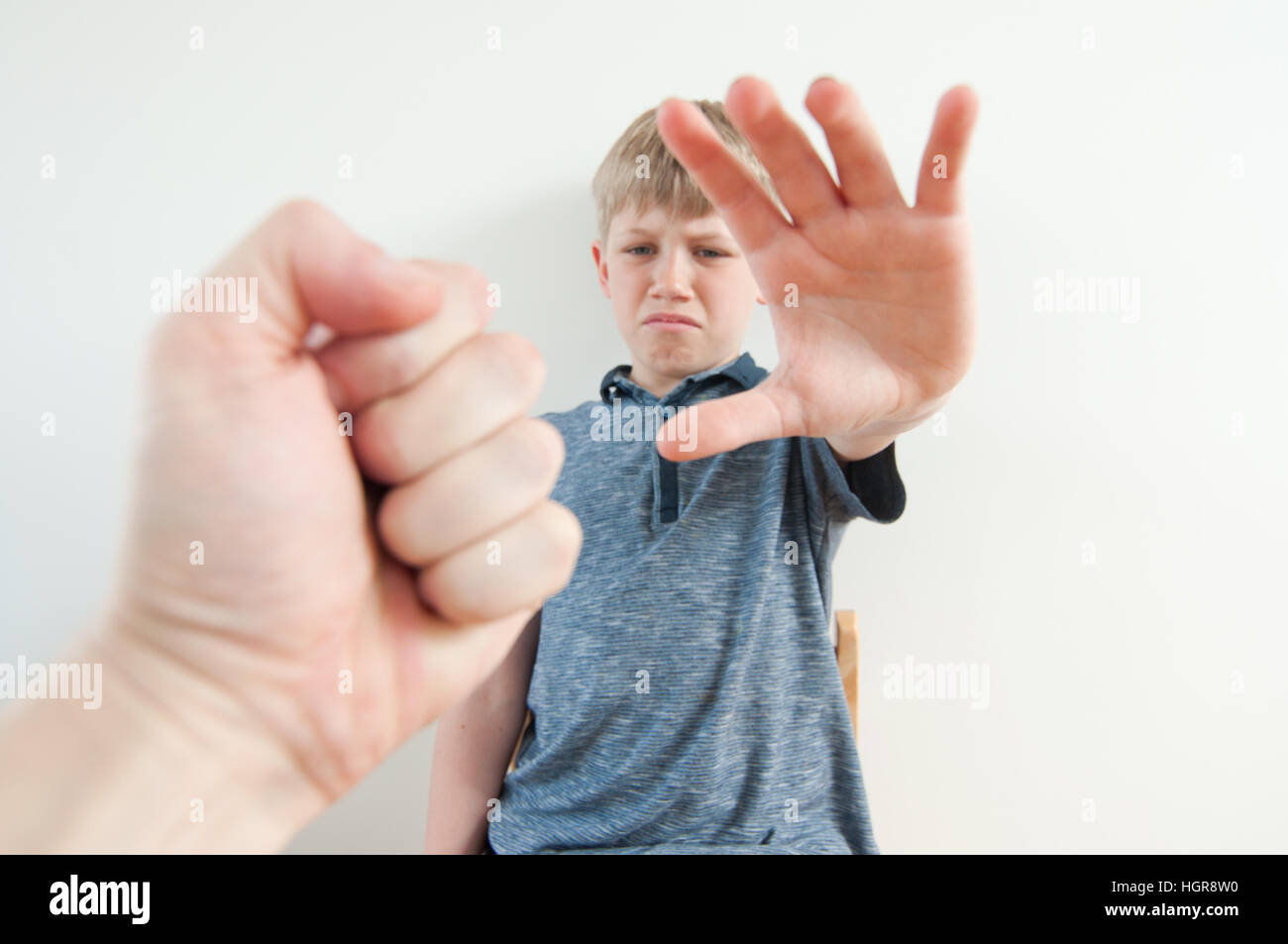 Point of view image of a parent raising their fist to a little child Stock Photo