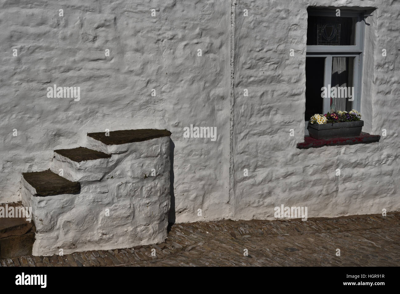 Mounting steps, Sun Inn , Main Street, Dent village, Yorkshire Dales National Park, Cumbria, England, UK. Stock Photo