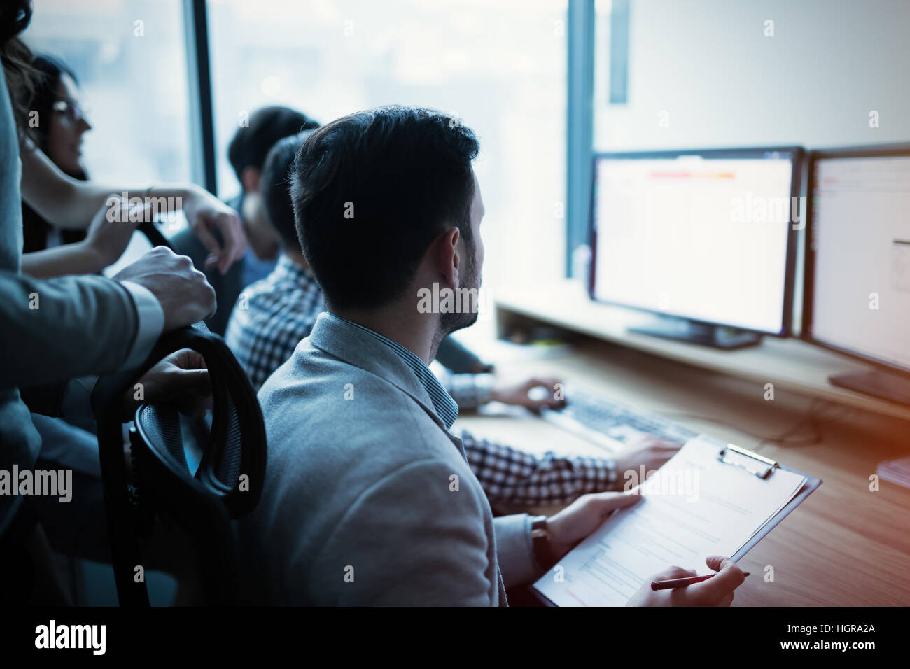 IT colleagues working on software development project in office Stock Photo