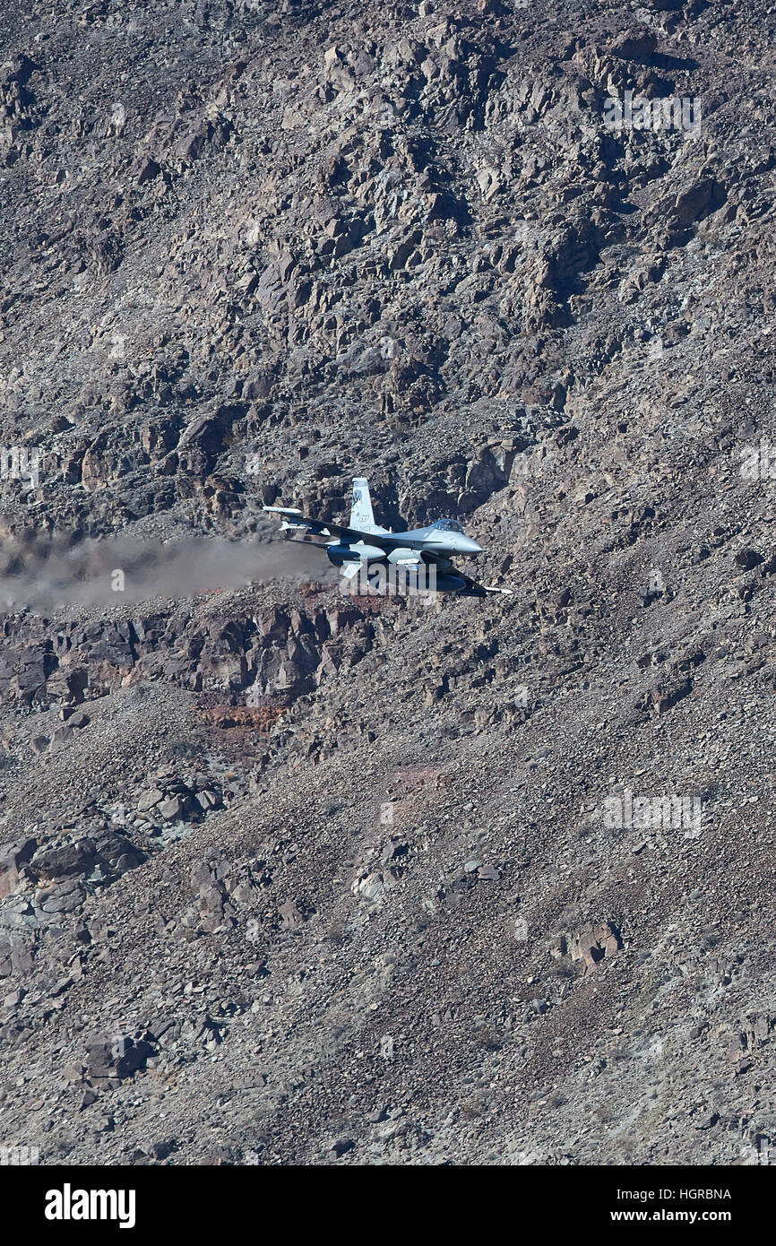 US Air Force Fighting Falcon, F-16C, Flying Through Rainbow Canyon, In Death Valley National Park, California. Stock Photo
