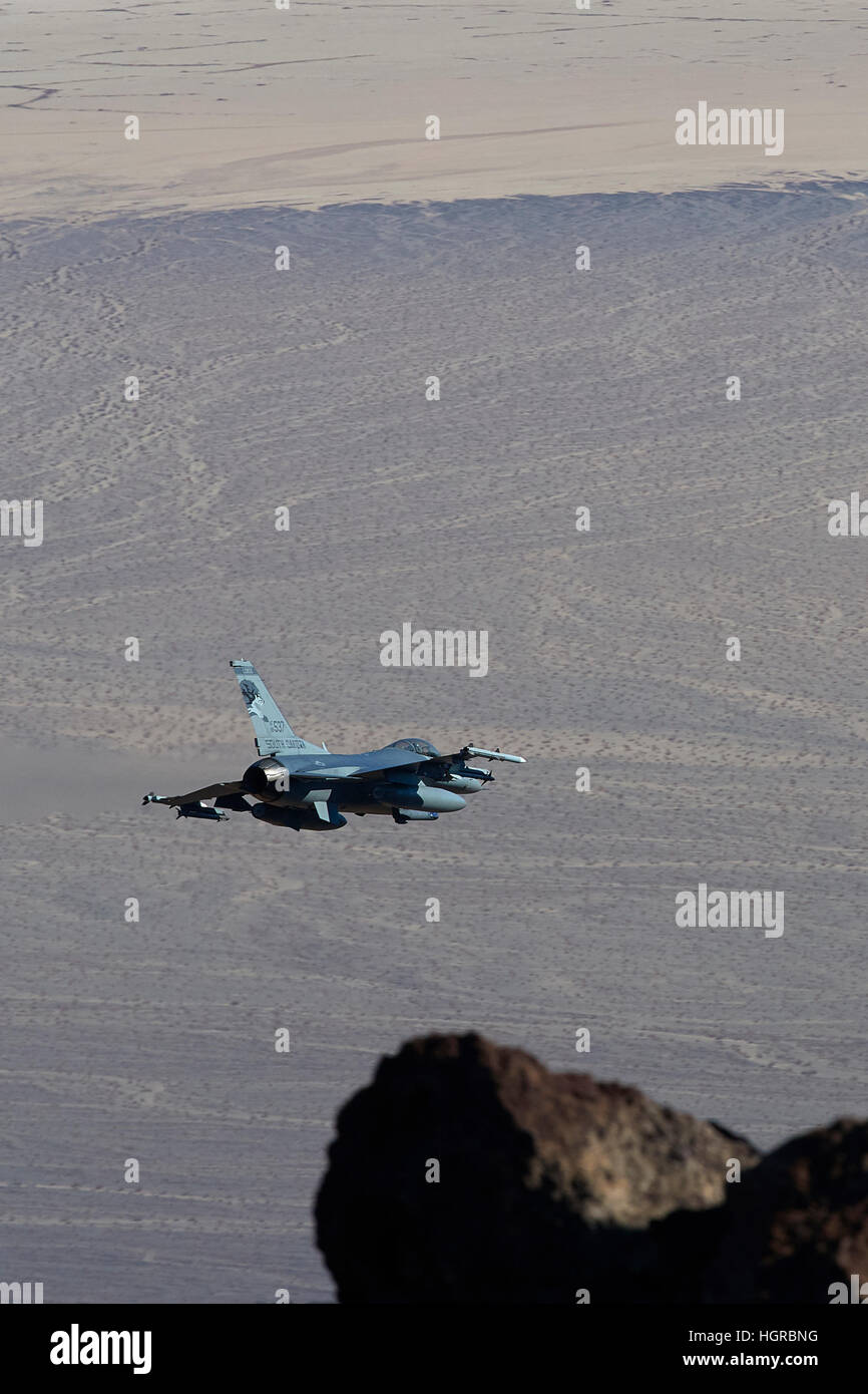 US Air Force Fighting Falcon, F-16C, Exiting Rainbow Canyon, In Death Valley National Park, California. Stock Photo