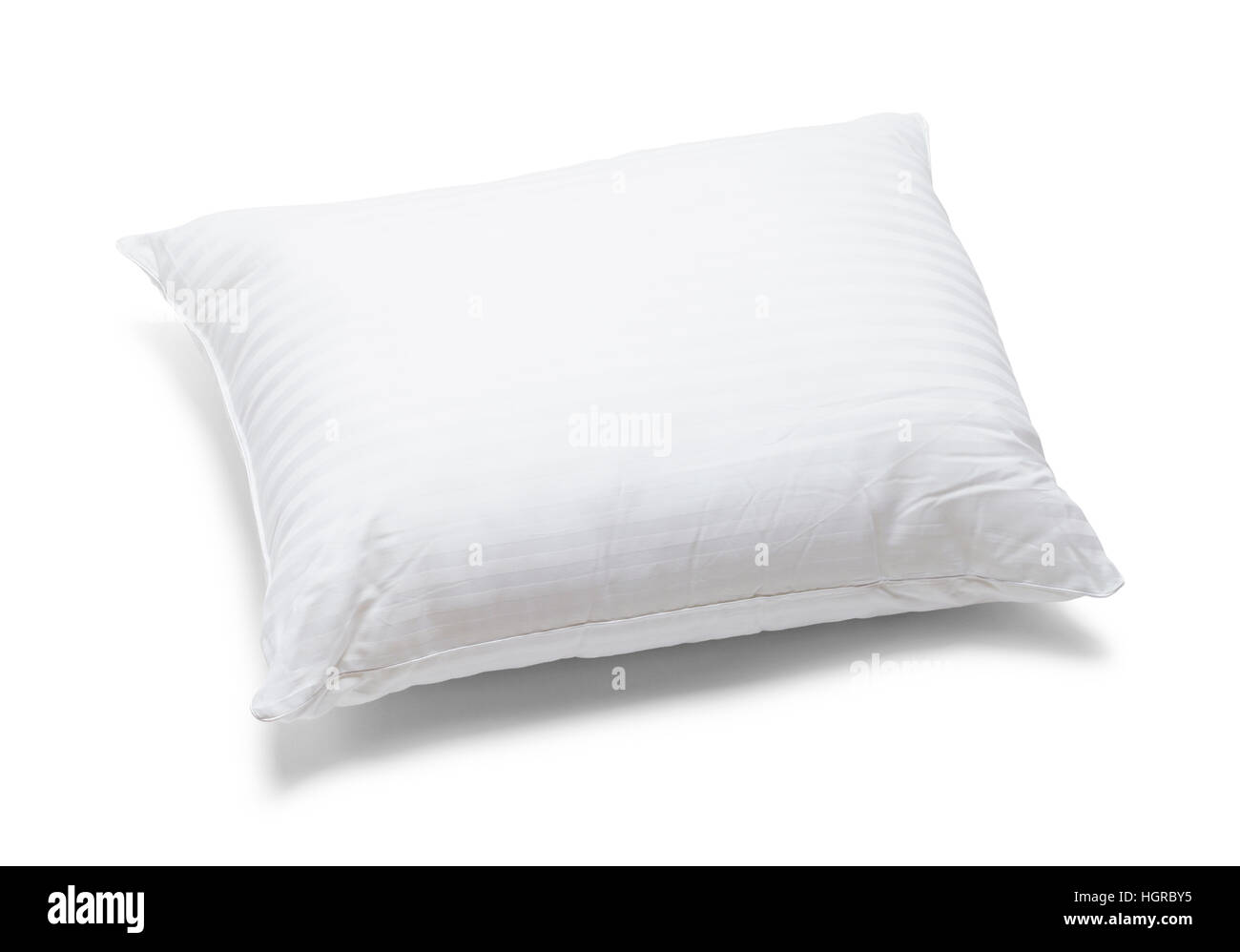 White Fluffy Bed Pillow Isolated on White Background. Stock Photo